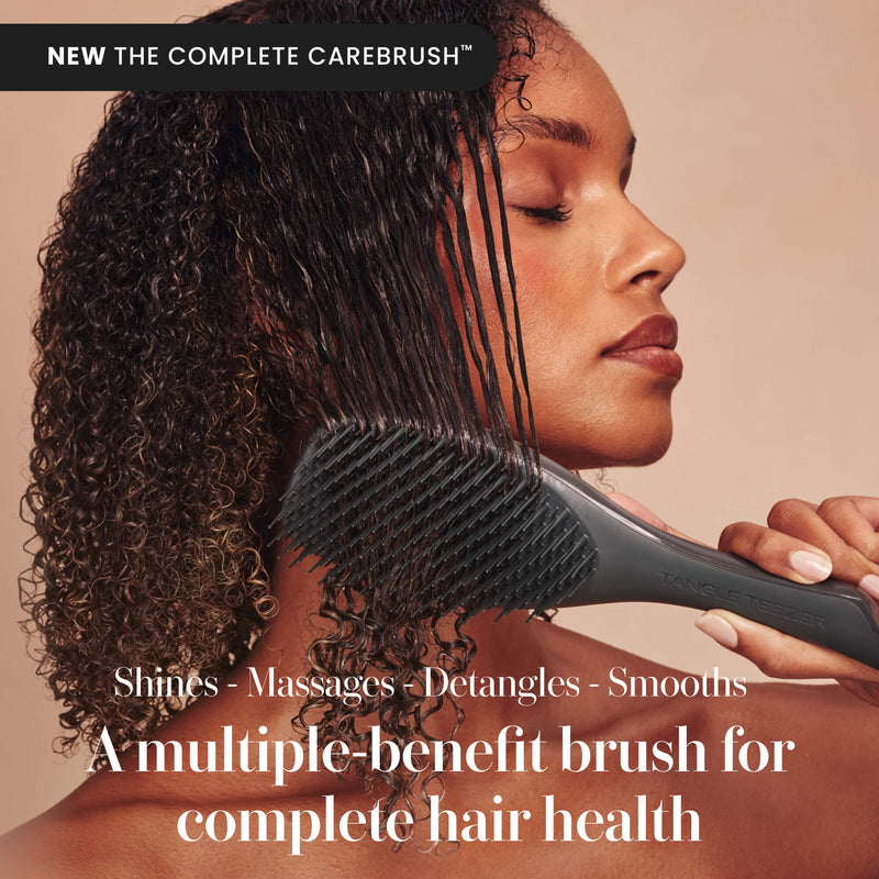 Model using the Tangle Teezer Complete Carebrush in Silken Slate